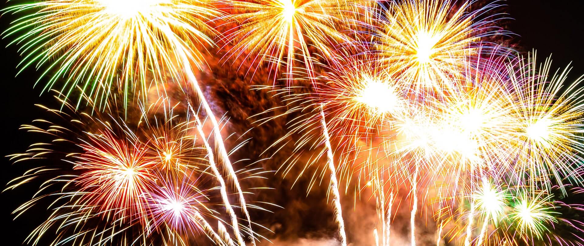 fireworks exploding - yellow, pink, red, green