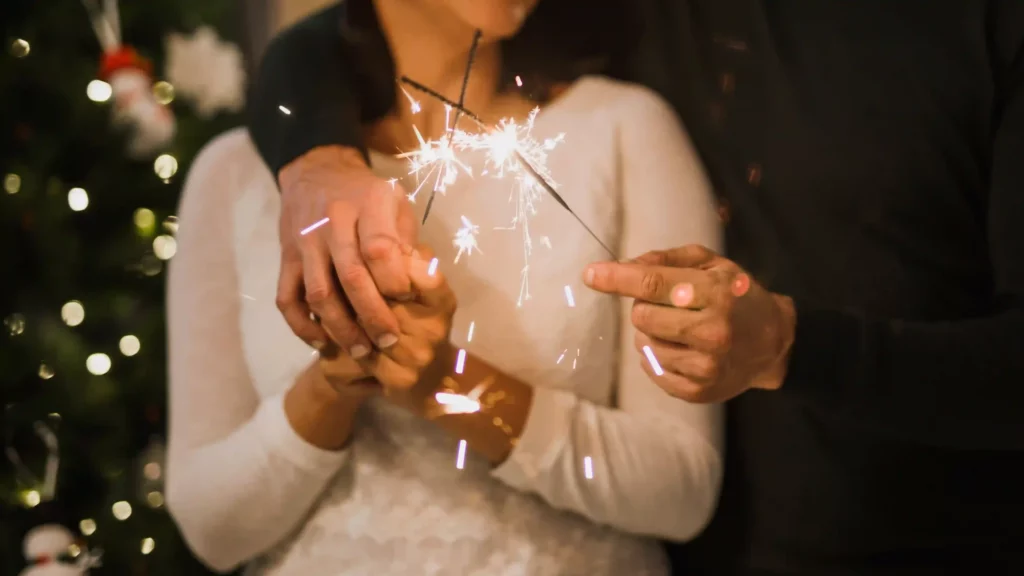 firework couple holding sparklers